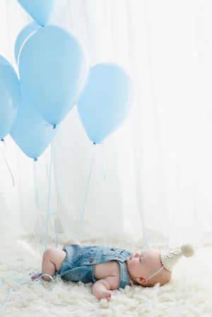 Colorado baby photographer for 6 month milestone photo shoot. Baby photo shoot in studio in Colorado. Denver Colorado baby photographer