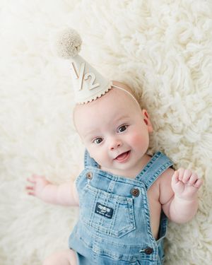 Colorado baby photographer for 6 month milestone photo shoot. Baby photo shoot in studio in Colorado. Denver Colorado baby photographer