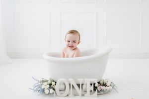 Studio cake smash photographer in Centennial Colorado. Colorado cake smash photo shoot in studio. Baby's First year cake smash photo session