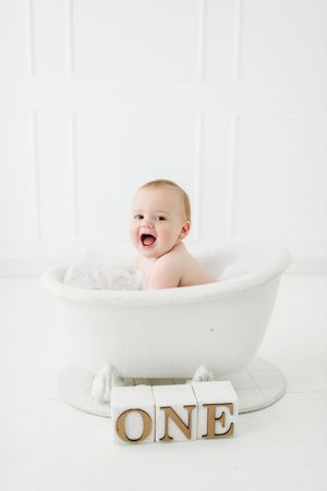 Studio cake smash photographer in Centennial Colorado. Colorado cake smash photo shoot in studio. Baby's First year cake smash photo session