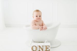 Studio cake smash photographer in Centennial Colorado. Colorado cake smash photo shoot in studio. Baby's First year cake smash photo session