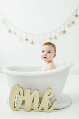 Studio cake smash photographer in Centennial Colorado. Colorado cake smash photo shoot in studio. Baby's First year cake smash photo session