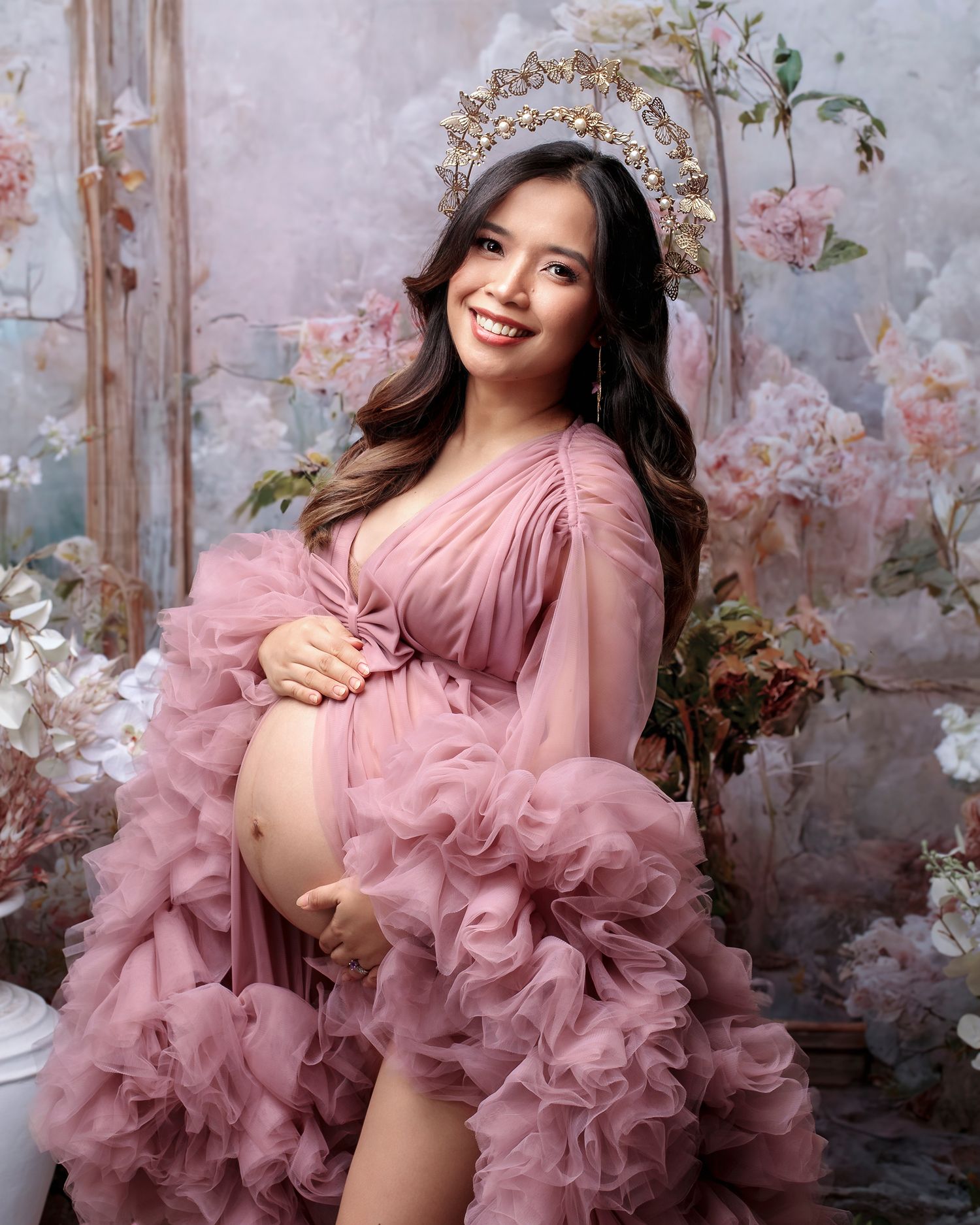 Pink gown with an open belly design, captured artistically by Caz Captures.