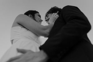 Close-up of couple holding hands by the lighthouse – alternative wedding