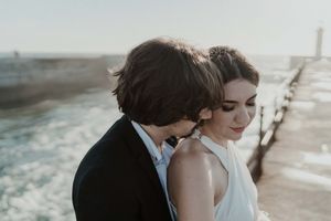 Groom holding bride close during emotional vows – elopement photographer Portugal