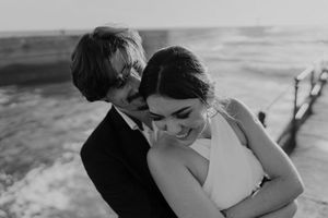 Groom holding bride close during emotional vows – elopement photographer Portugal