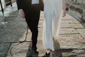 Close-up of couple holding hands by the lighthouse – alternative wedding
