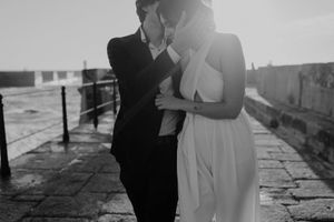 Close-up of couple holding hands by the lighthouse – alternative wedding