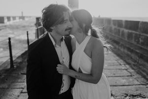 Close-up of couple holding hands by the lighthouse – alternative wedding