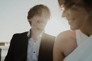 Couple walking along the rocks at sunset – elopement Portugal