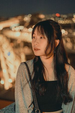 Evening portraits with bokeh lights creating a dreamy metropolitan atmosphere.