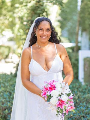 A series of bridal portraits showing a bride in a white dress holding a vibrant pink and white stargazer lily bouquet.
