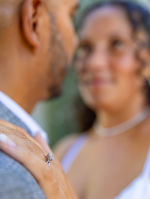 A soft focus collection of engagement photos showing a couple holding hands and embracing in romantic poses outdoors.