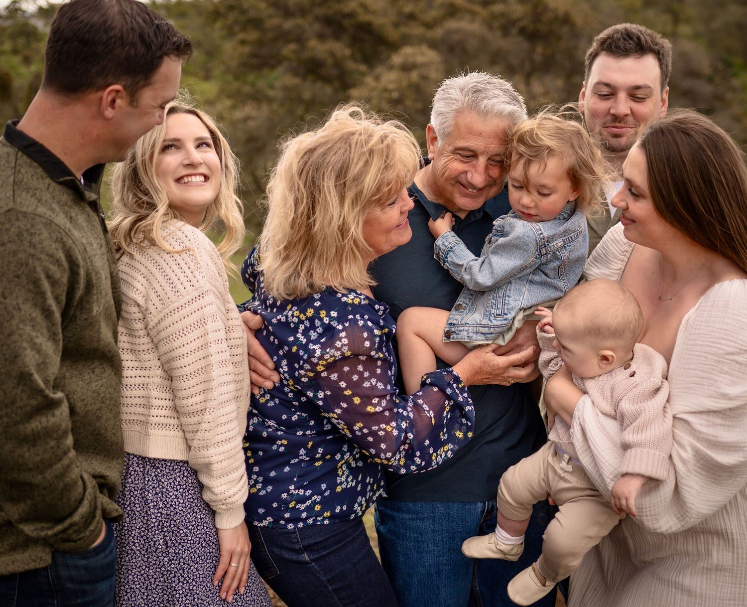 A family hugging in a lifestyle family portrait