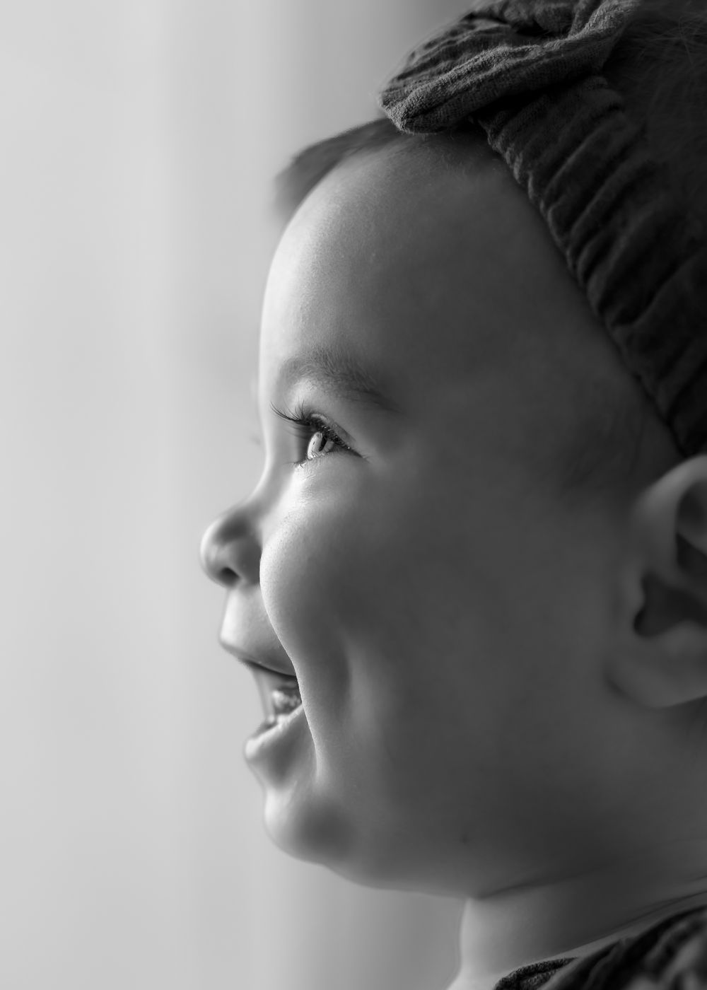 A sequence of profile views showing someone looking up at different angles in black and white.