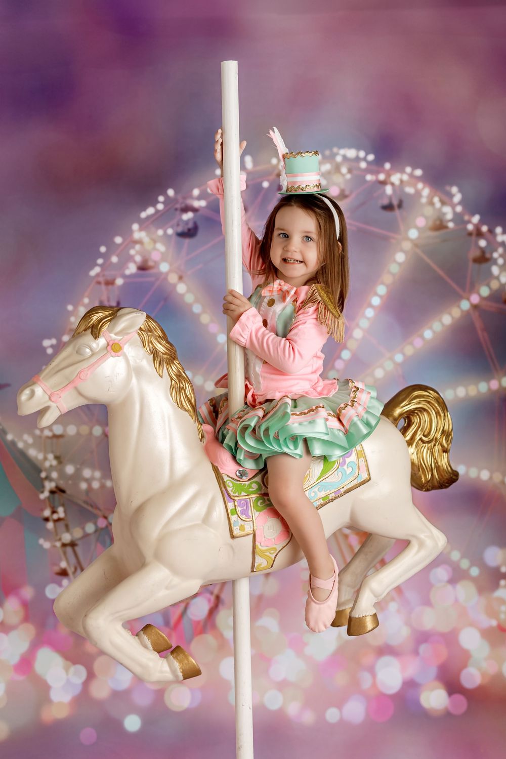 Carousel series showing child in pink dress riding decorative white carousel horse against sparkly bokeh background.