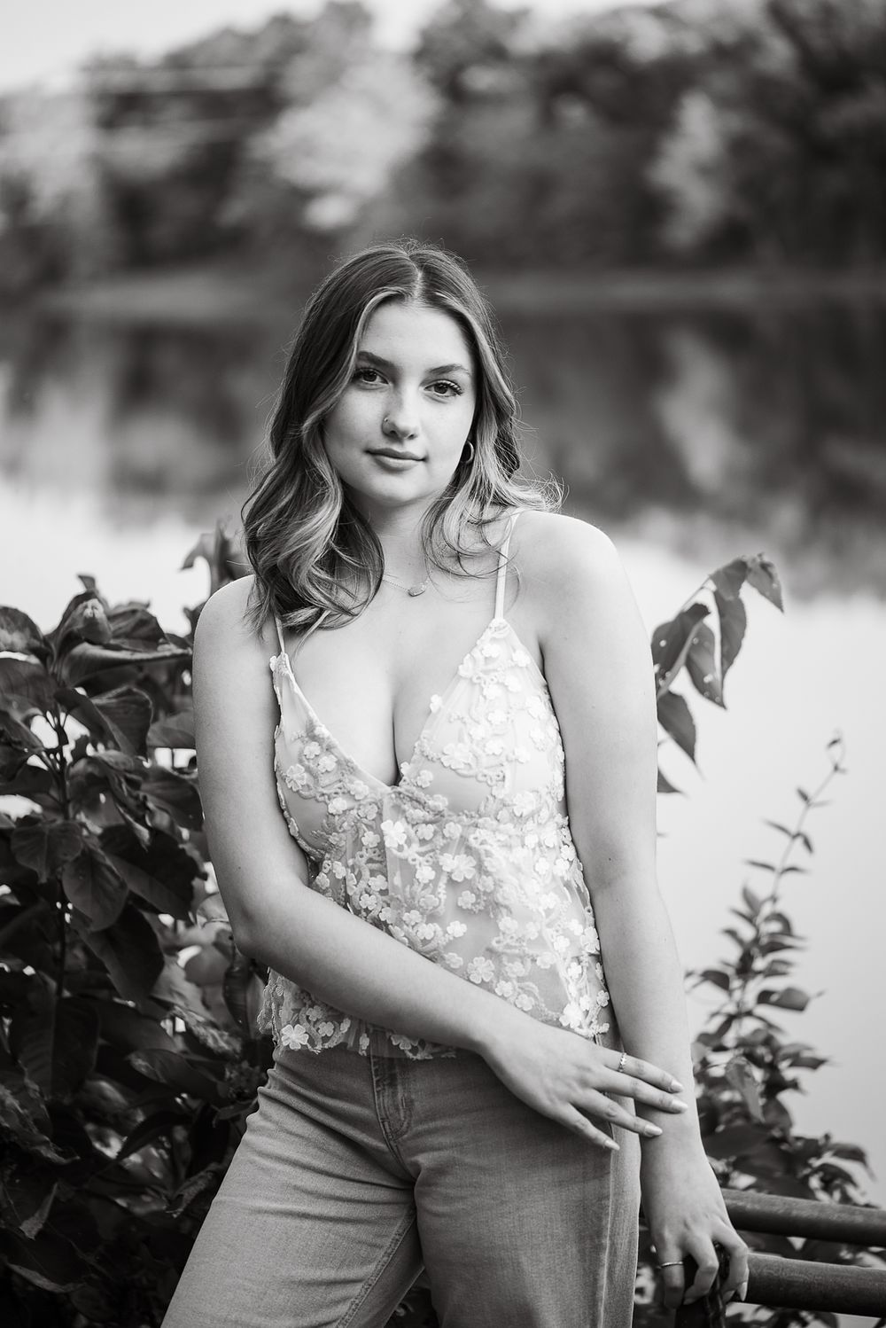 High school senior photographer Kansas City, Black and white portrait in lace top by waterfront with natural styling.