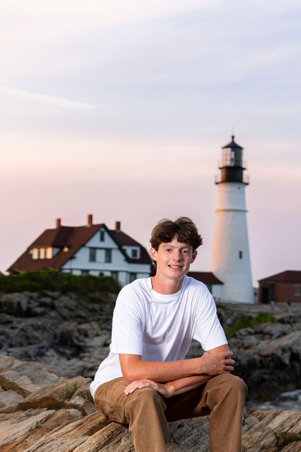 Senior portrait with Portland headlight in the background