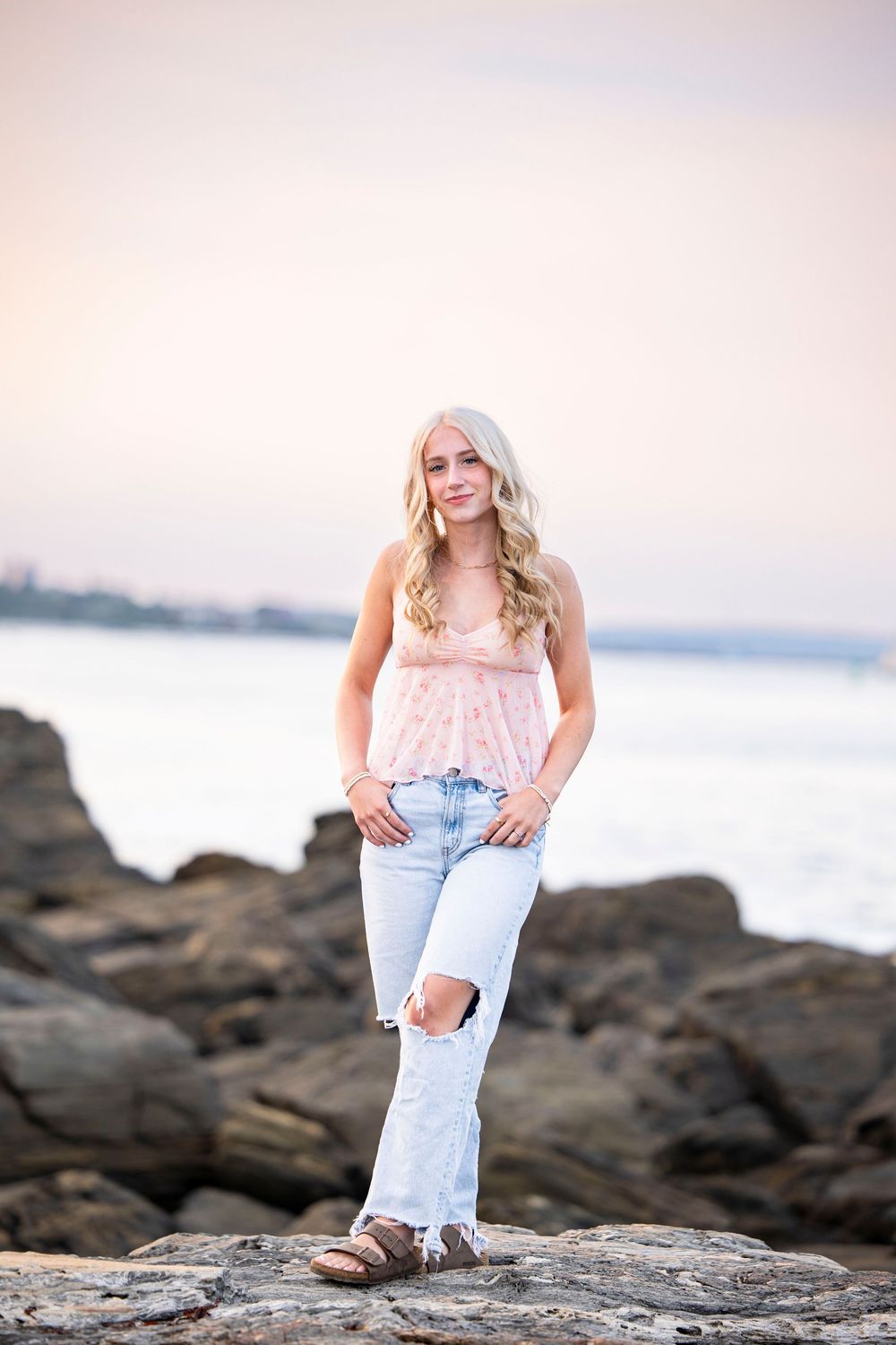Senior portrait on the rocks at Fort Williams Park in Cape Elizabeth Maine.