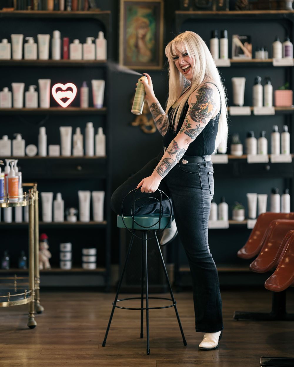 Samantha, a female hair stylist, posing at The Young American Hair Salon