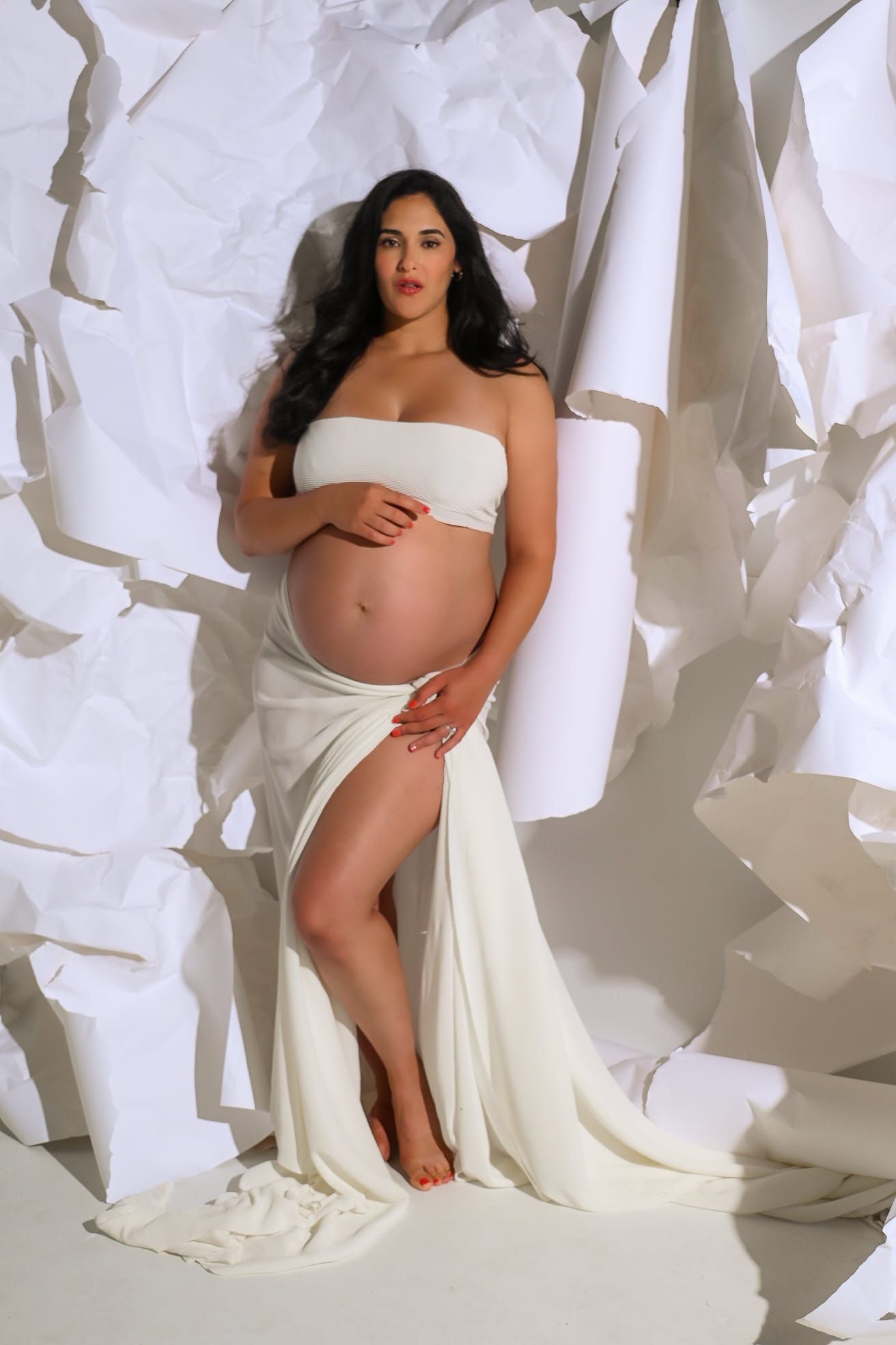 pregnant woman in a paper background with Greek goddess vibe, beautiful, chic, aesthetic, empowered image