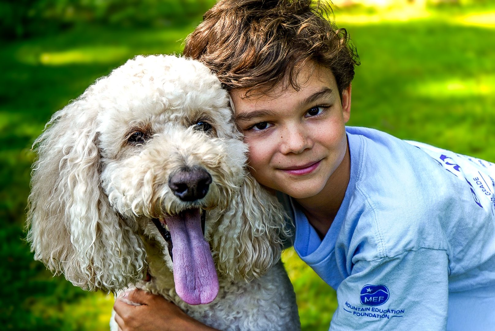 pet portraits with boy during a lifestyle photo session with tay portraits the best Chattanooga family photographer