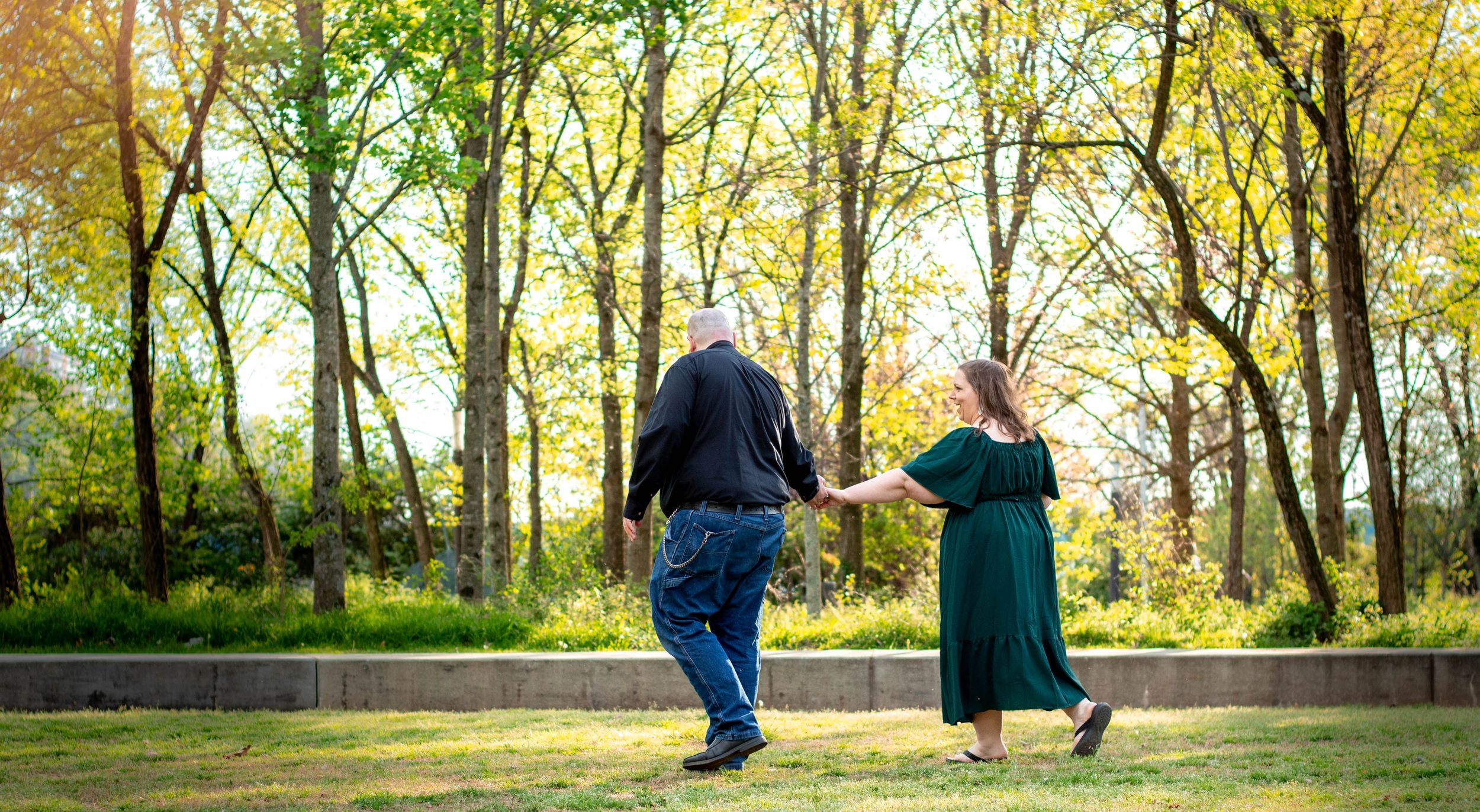 couple walking for engagement photo session with tay portraits the best Chattanooga family photographer