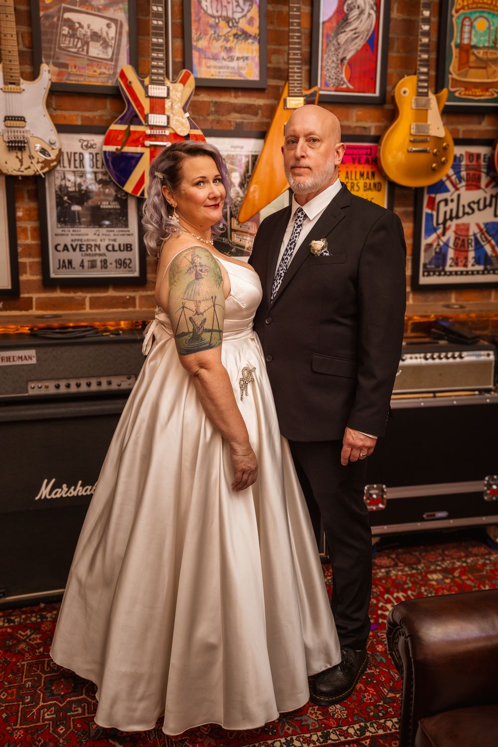 A couple on their wedding day at a unique music venue.