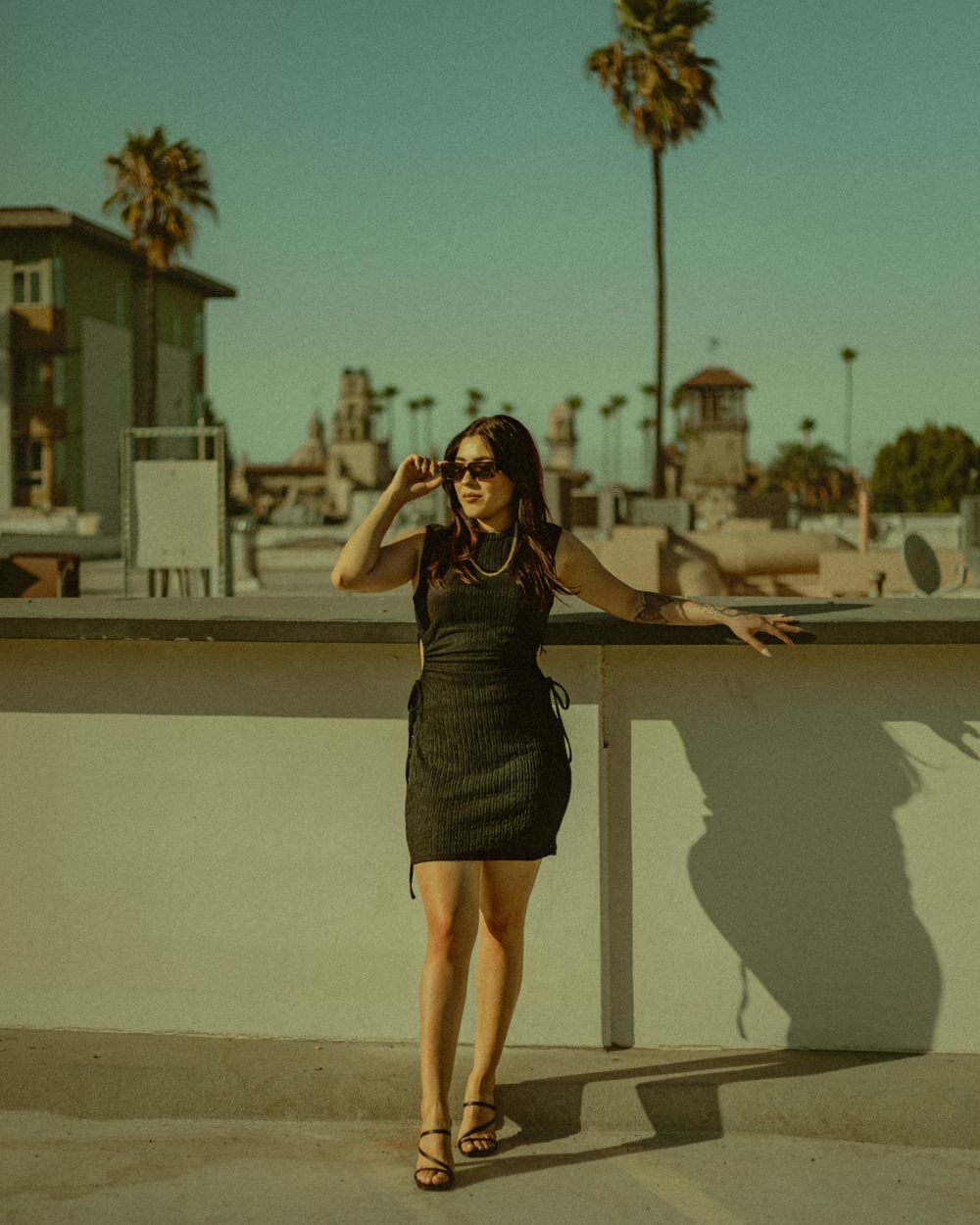 Fashion branding photography in Downtown Riverside California with model modeling sunglasses