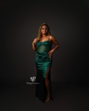 Senior photoshoot with young black woman wearing emerald prom dress; Lexington, SC senior photographer; indoor photoshoot South Carolina