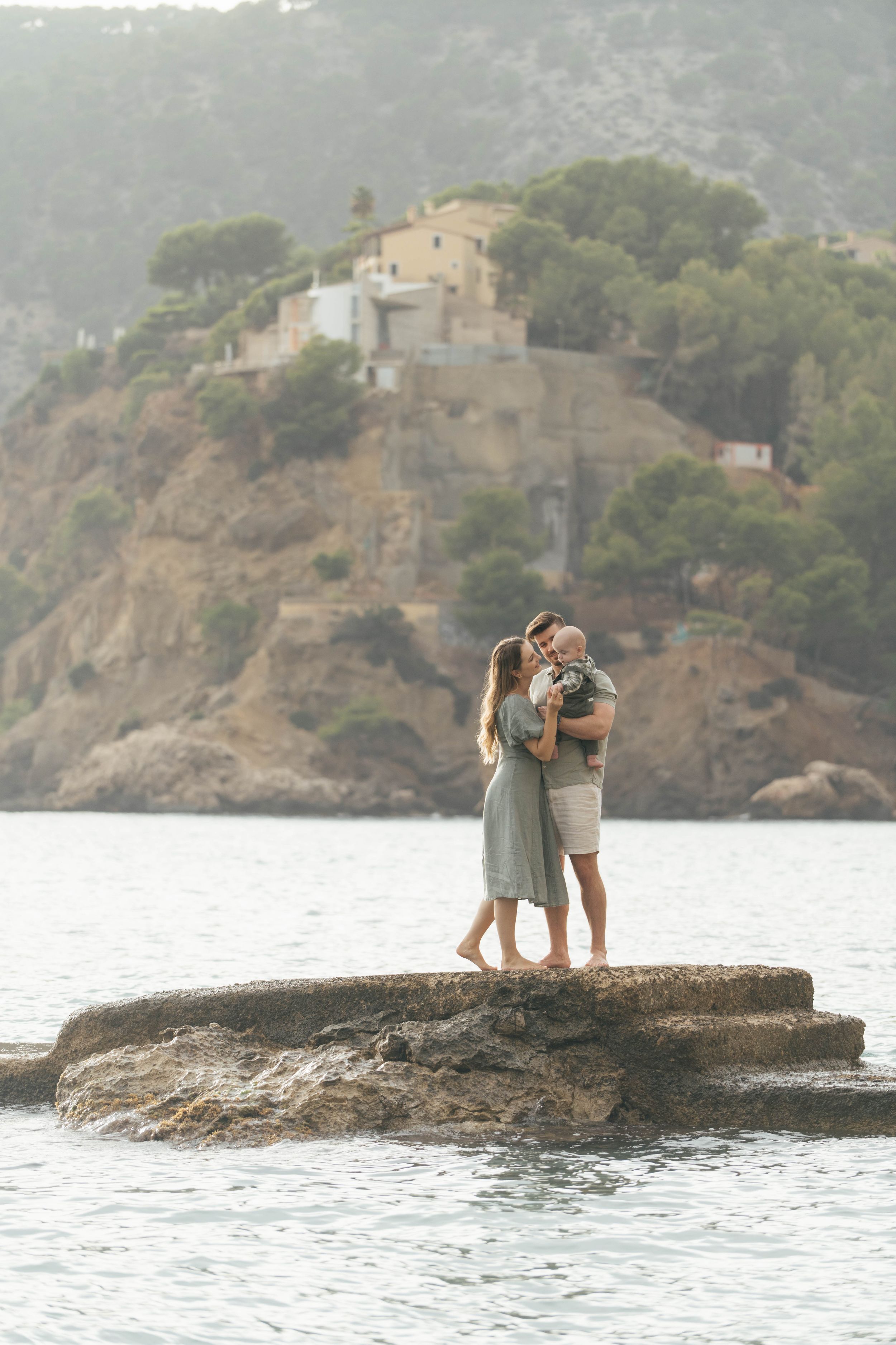 Family on the rocks of Camp de Mar, Mallorca