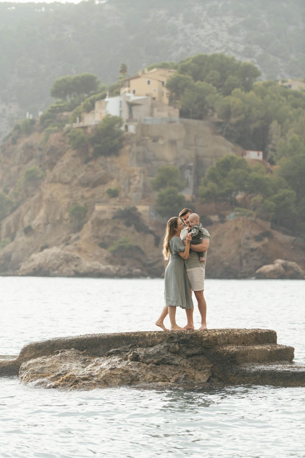 Family on the rocks of Camp de Mar, Mallorca