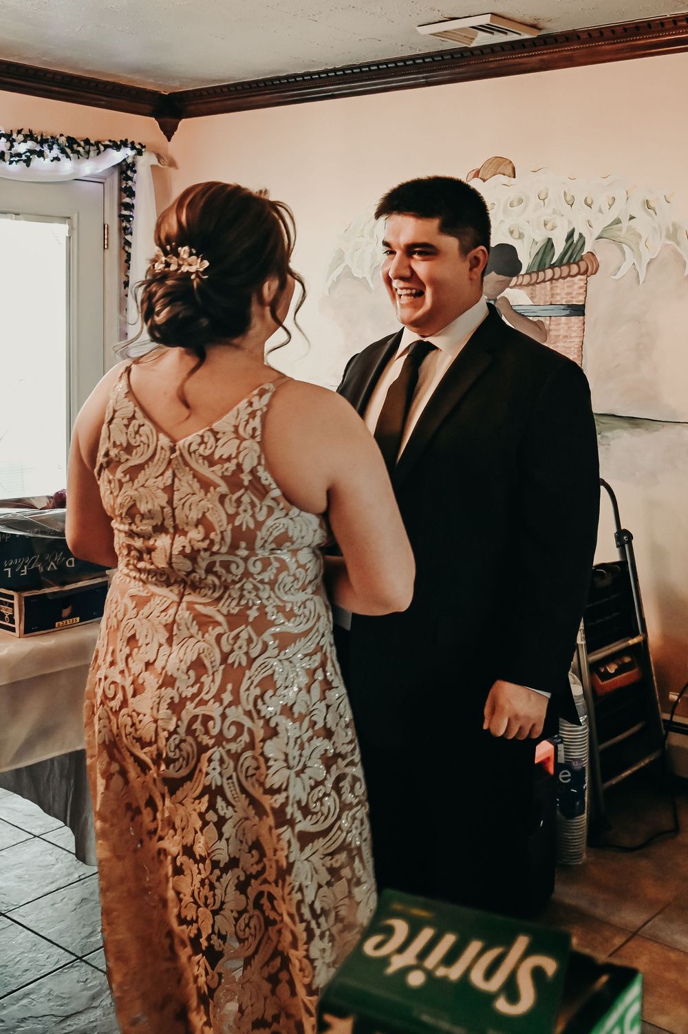 A couple sharing a happy moment in formal wedding attire.