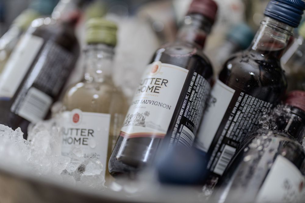 Close-up of assorted liquor bottles with selective focus on bottle labels.