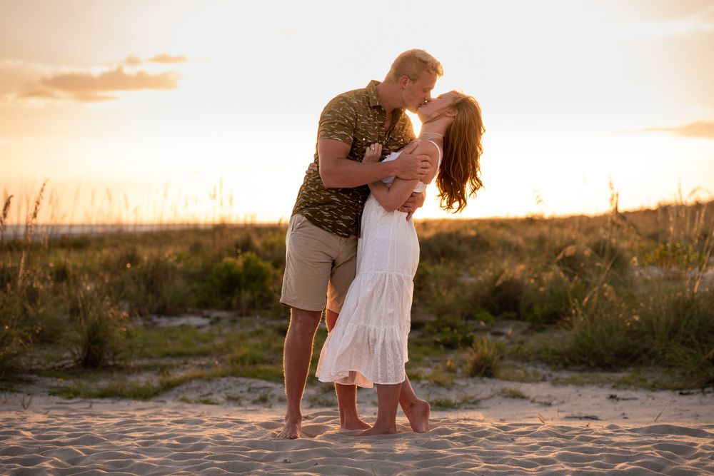 Sunset photographer near me on the beach in Destin Florida. Couples engagement photo on white sandy beaches near the ocean