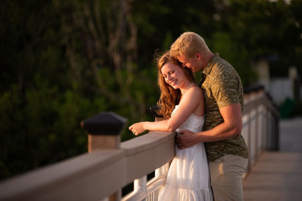 Destin Florida couples photographer captures stunning candid moments for newly engaged couples during sunset on the beach
