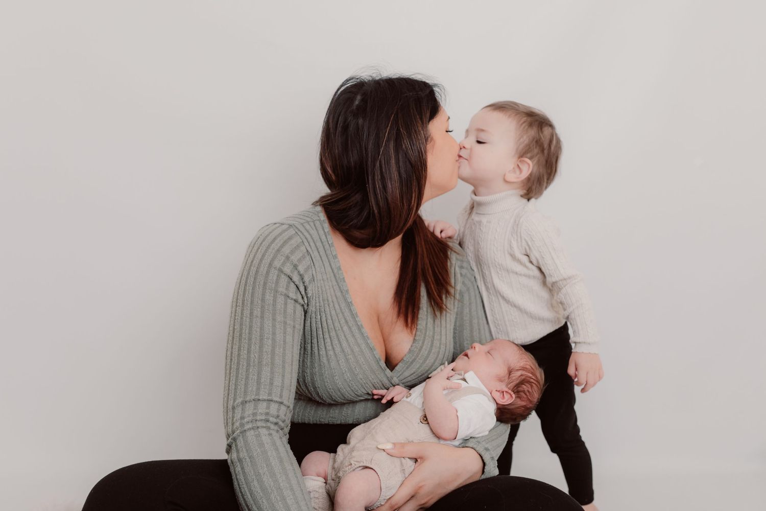 Tender family moment captured during intimate portrait session against light background. Photographer. Hull. East Yorkshire. Photography