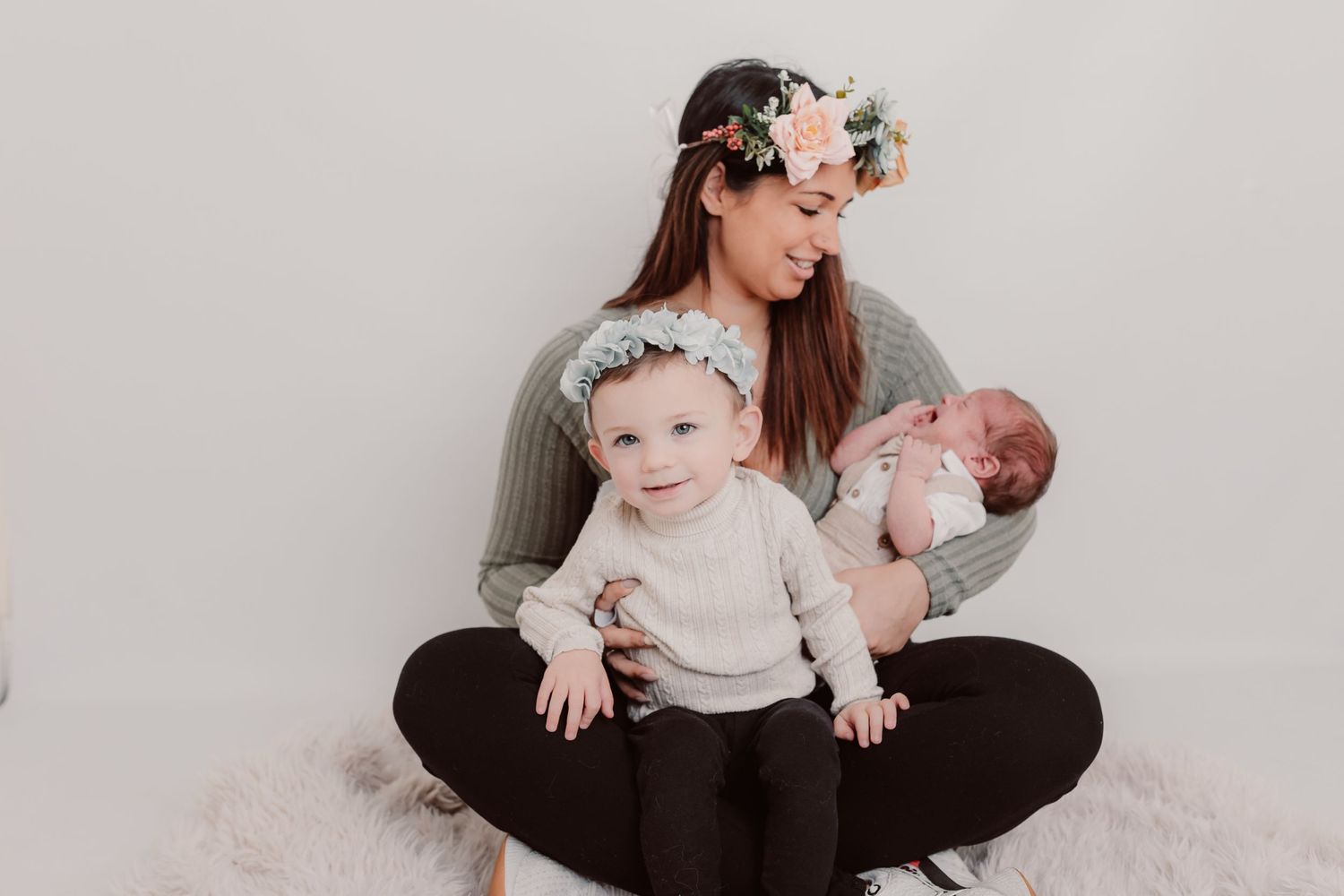 Family portrait session showing loving interactions against minimalist white backdrop. Photographer. Hull. East Yorkshire. Photography