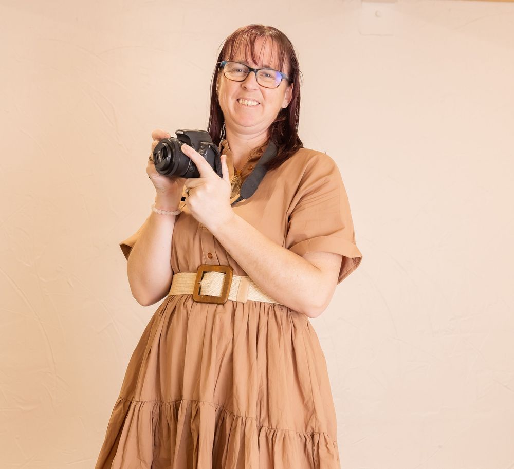 lady with brown hair dressed in black