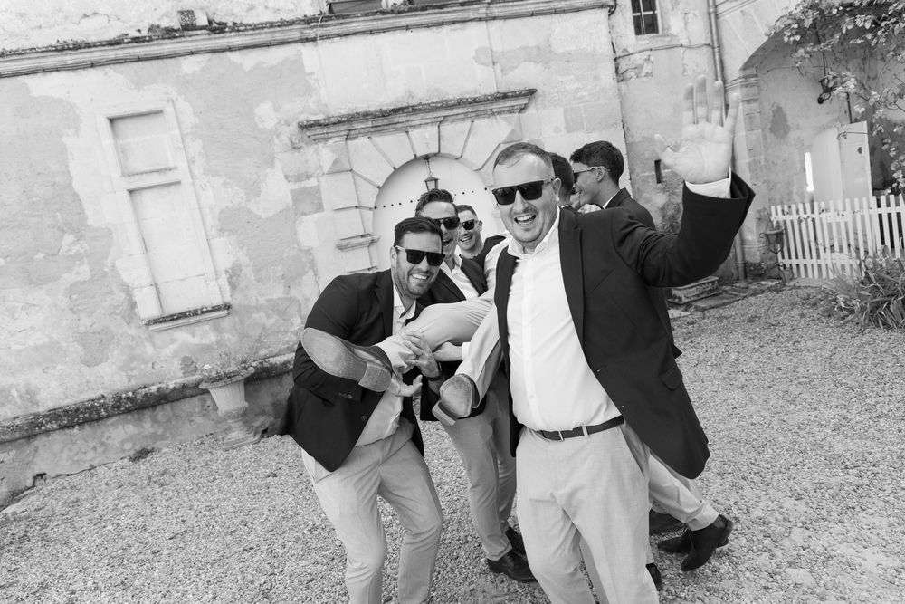 People dance and pose in a series of black and white vintage photographs showing joyful outdoor celebrations.