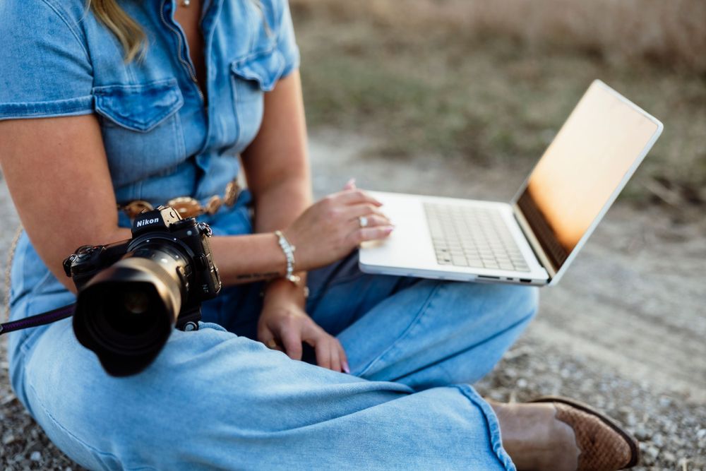 Photographer posing with camera, showcasing their passion for capturing memorable moments and stunning images.