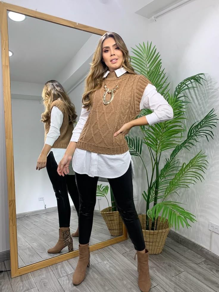 Brown knit sweater vest outfit shown in multiple mirror reflection shots with white shirt and black pants.