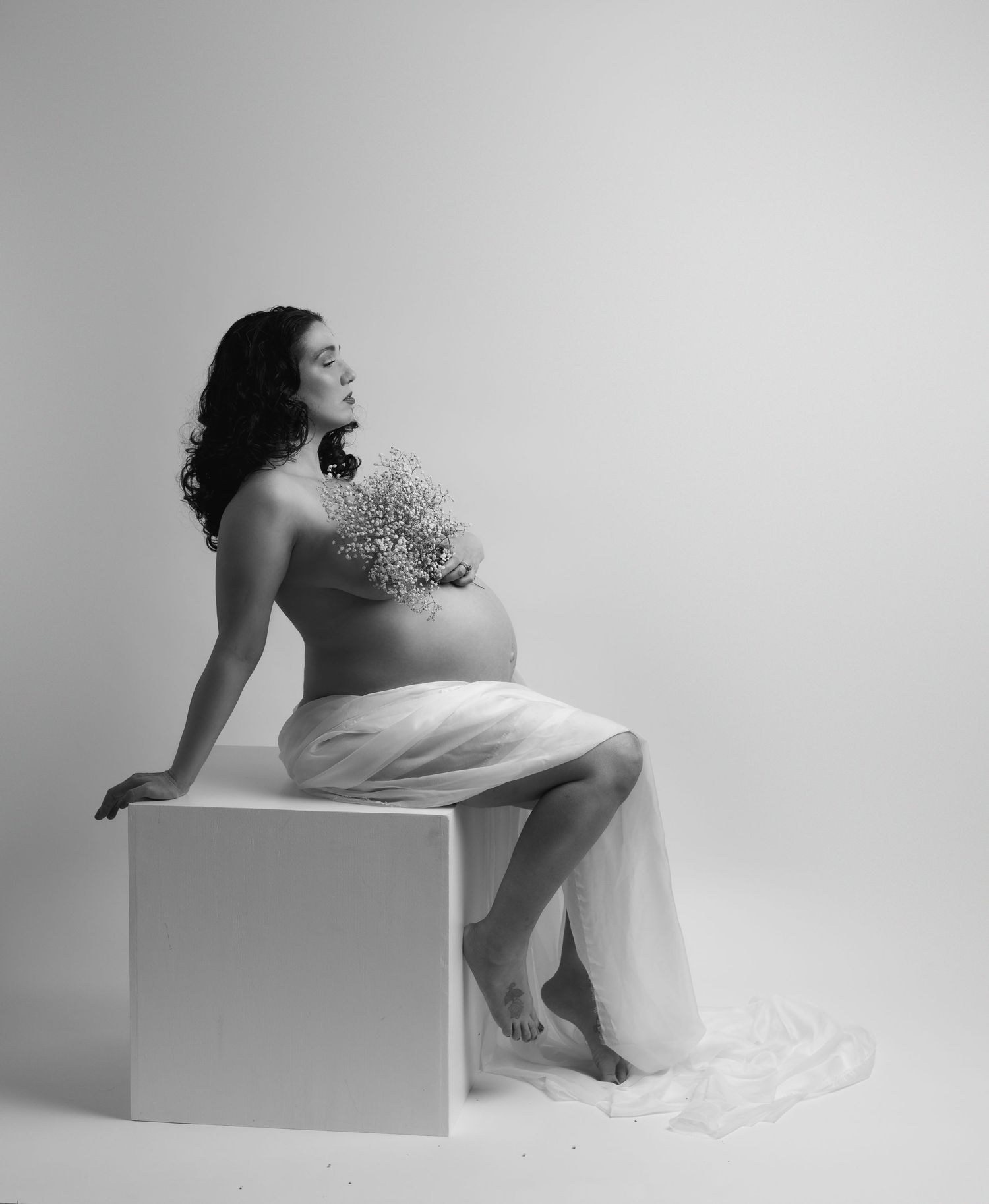 Fine art black and white floral maternity portrait