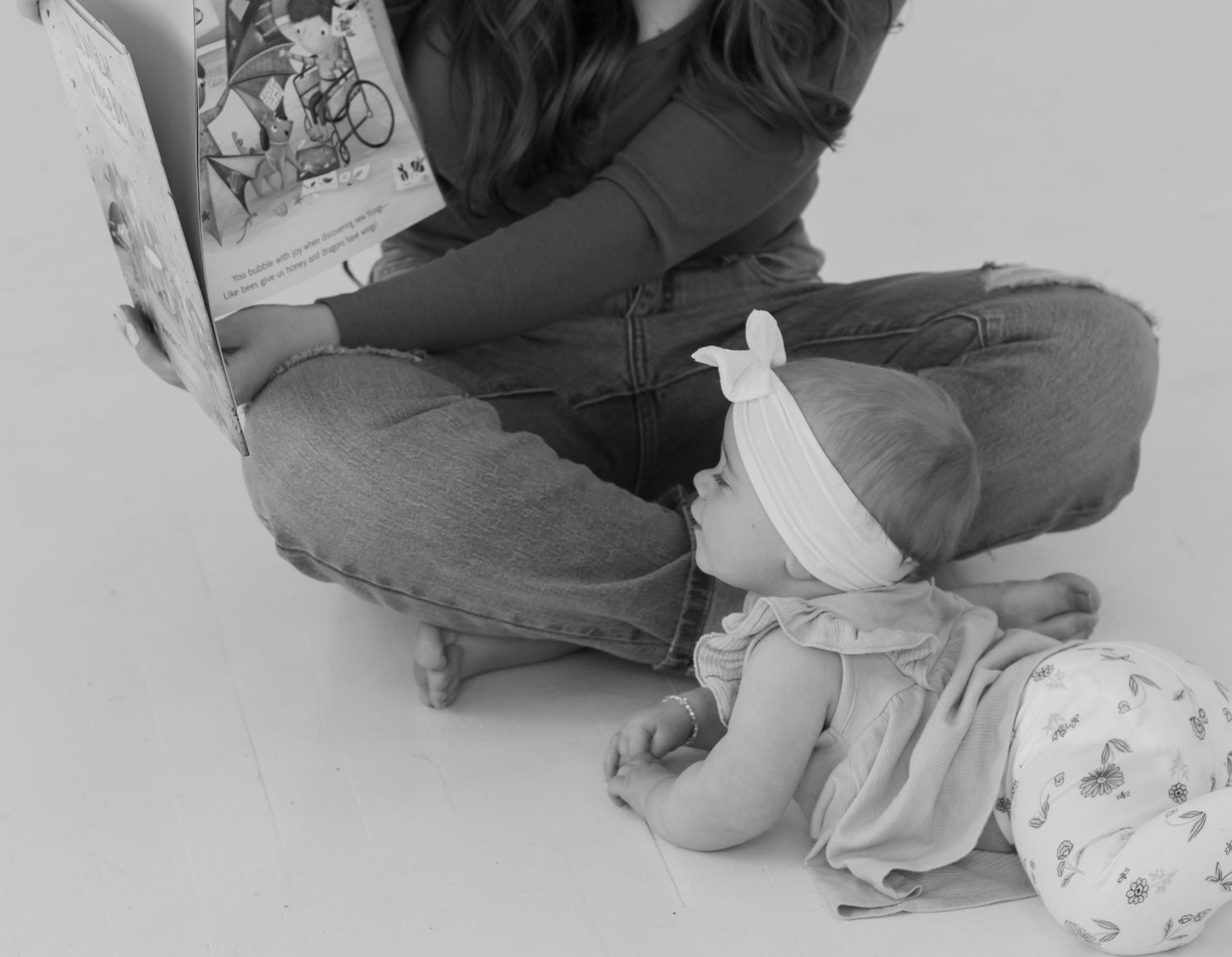 A quiet reading moment with folded clothes and decorative white bird.
