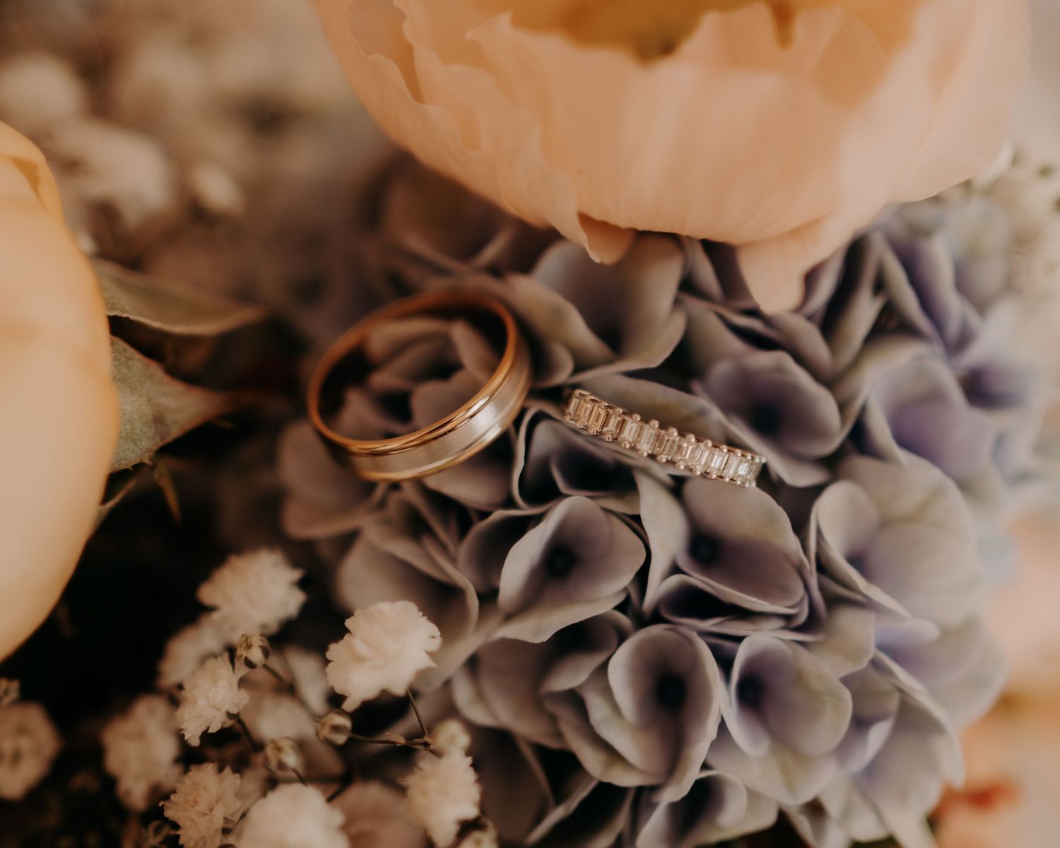Close-up detail of pale purple hydrangea flowers in a wedding arrangement.