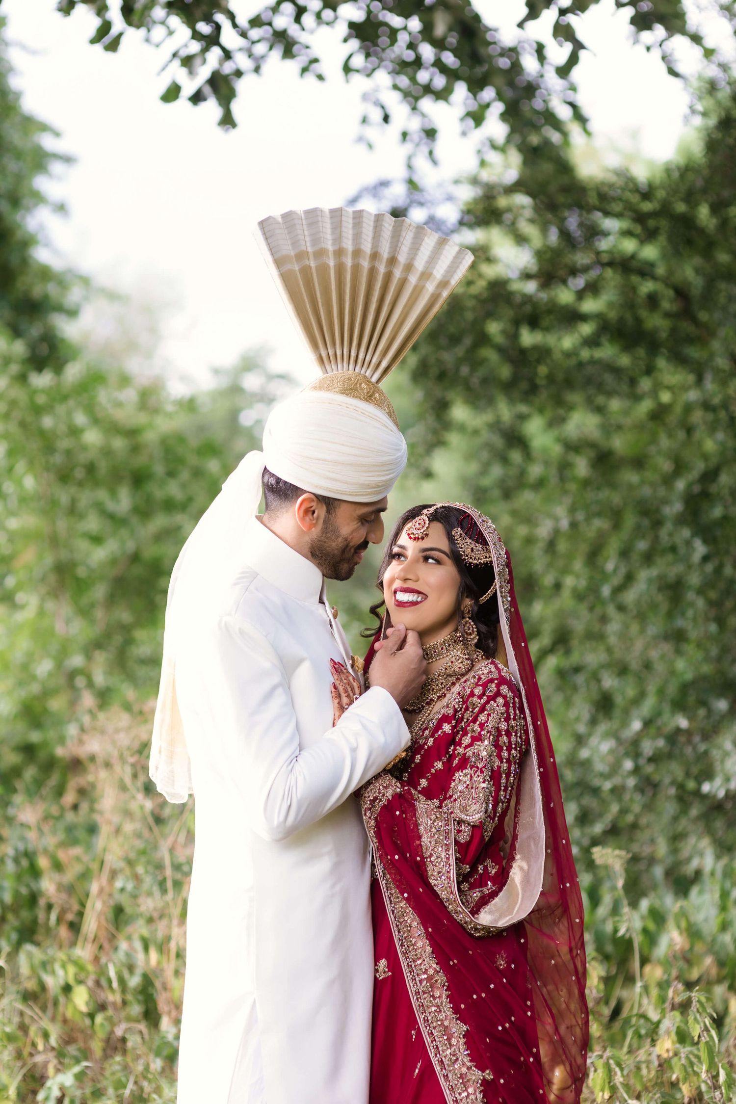 Pakistani Newly wedded couple posing for khush studio photographer.