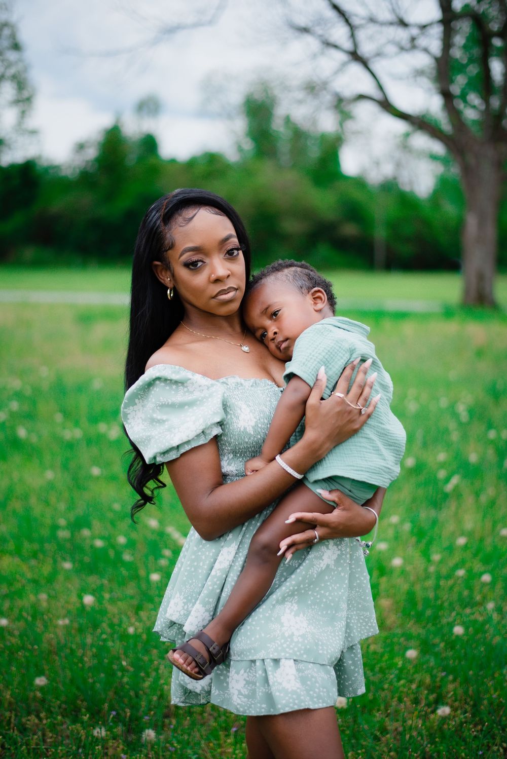 A touching outdoor portrait in a green meadow on a spring day.