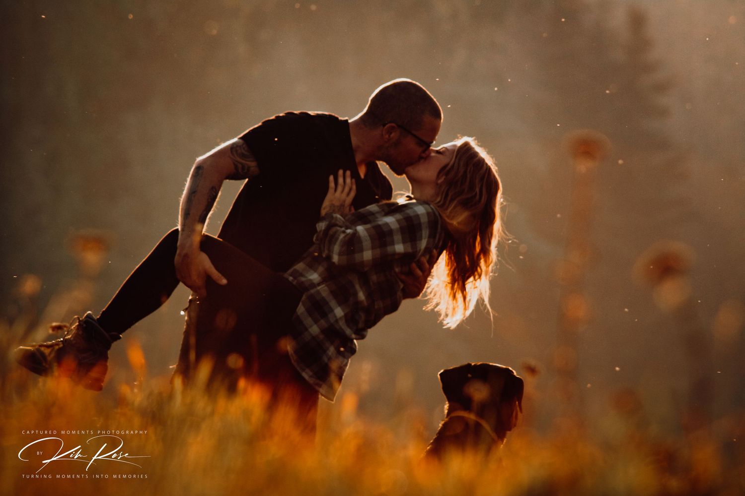 Young couple laughing together while walking through a vibrant wildflower field in the Yukon