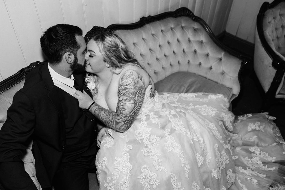 Black and white wedding photos showing tender moments between newlyweds during their romantic celebration.