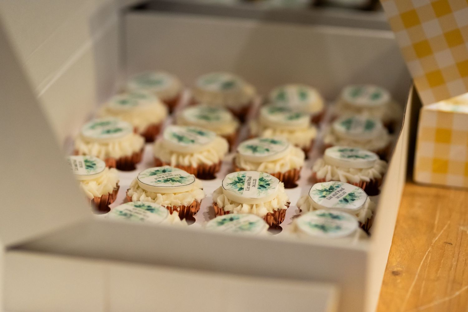 Decorated cupcakes with blue frosting arranged on a display tray.